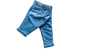 Denim pants displayed in a creative flat lay against a clean white background