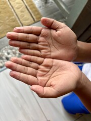 Kids wrinkles fingers after playing water, focusing on the texture and detail. Ideal for health, hygiene, and skin care themes