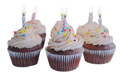 Colorful cupcakes decorated with frosting and candles for a festive celebration