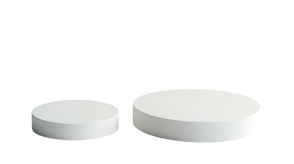 White circular platforms of varying sizes arranged for display in a modern setting