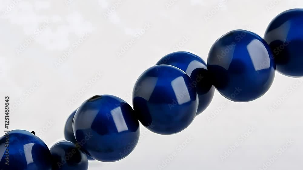 Poster series of blue spheres are floating in the air. the spheres are all different sizes and are scattere