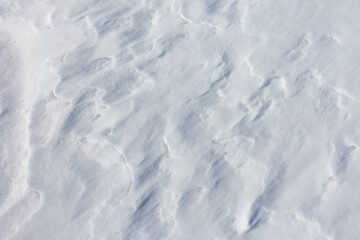 The snow is white and the ground is covered in it