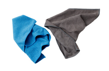 Two towels, one blue and one gray, are folded and placed on a white background