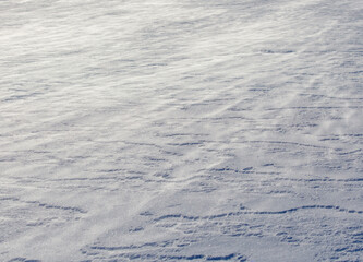 The snow is white and the ground is covered in it
