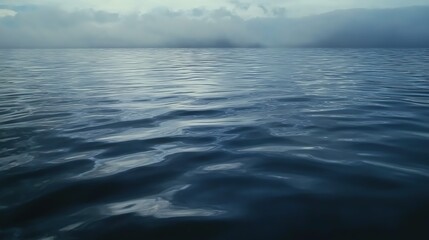 Fototapeta premium Tranquil Dark Blue Water Under An Overcast Sky
