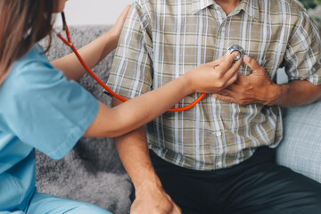 Female doctor listening to heartbeat