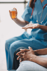 Female doctor discusses medication with patient