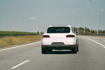 Fototapeta premium High-performance German SUV driving down highway.