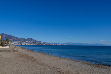 Photo of the beautiful beach front in the town of Fuengirola Mijas in Spains Costa Del Sol showing the sandy beach front known locally as Playa El Ejido on a sunny day