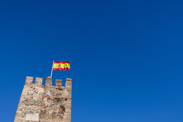 Photo of the Spanish flag showing the flag from Spain blowing in the wind on a clear sunny summers...
