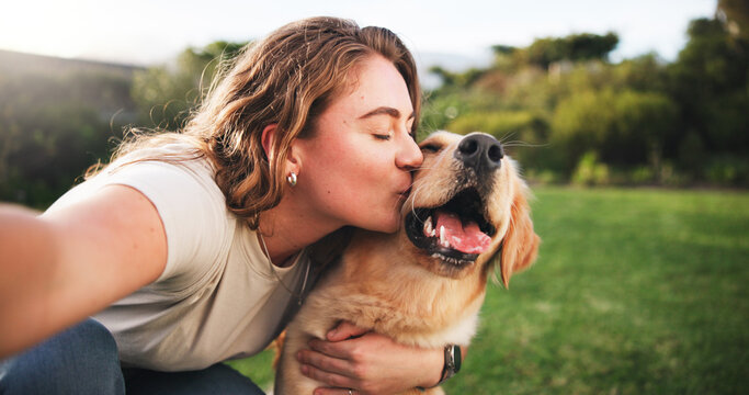 Woman, kiss and selfie with dog on grass field for picture, memory or companion in nature. Female person, labrador or golden retriever with hug or affection for capture, support or care for pet