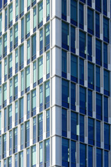 Blue glass windows of a skyscraper.