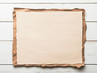 Fototapeta premium Cream-colored textured paper with a brown border rests on a white wooden surface. Perfect for adding your own text or design.
