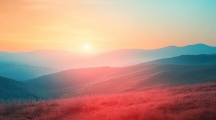 Obraz premium Mountain landscape during sunset with vibrant sky and silhouette of peaks against the horizon