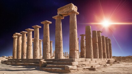 Obraz premium Ancient stone columns in warm beige tones against a deep starry backdrop with a glowing sun flare positioned to the right on a bright day.