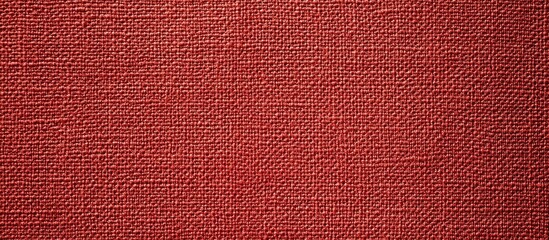 Fototapeta premium Close up of a rich red textured fabric background with intricate details and vibrant hue, perfect for textile and design projects.