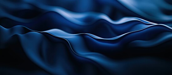 Obraz premium Smooth waves of deep blue fabric create an elegant flow, with soft shadows and highlights enhancing its luxurious texture and depth.