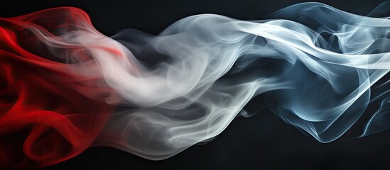 Fototapeta premium Dynamic smoke swirling in red, white, and blue on a dark background, creating an artistic representation of a waving flag with fluid movement.