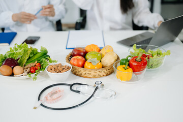 Fresh vegetables, fruits, and healthy food concepts combined with medical nutrition care, wellness, and diet planning