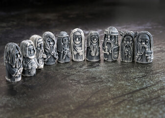 old ritual stone idols close up on abstract dark background. gods totems in traditional Slavic folk...