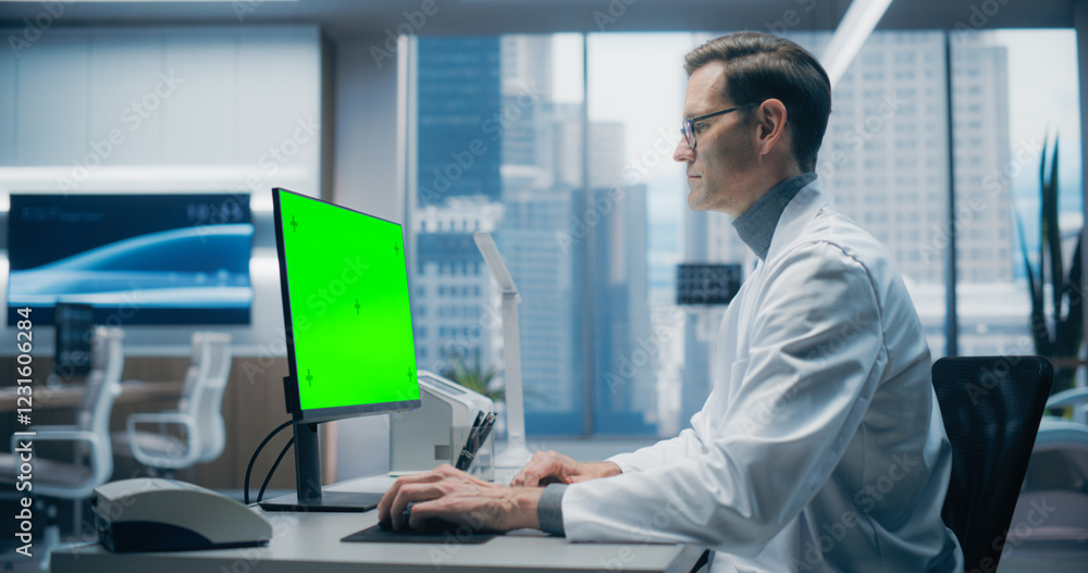 Poster male scientist in a white lab coat works on a green screen computer in a modern medical lab, focusin