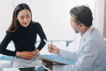 Caucasian woman complaining about her ailments to the doctor