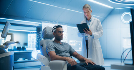 Doctors in a Futuristic Lab Use Advanced Technology to Scan a Patient's Brain, Analyzing Data on High-tech Monitors. Patient, Connected to a High-Tech Device