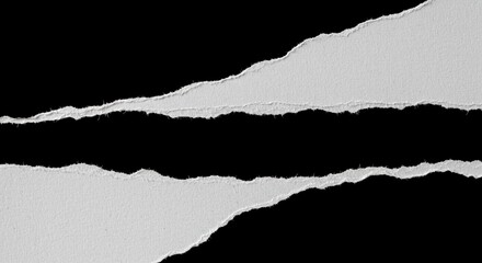 Ripped torn paper edges isolated on black background