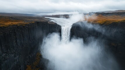 Fototapeta premium World water day with conservation and supply idea. Majestic waterfall cascading into a misty gorge.