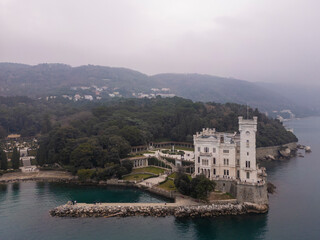 Obraz premium Aerial view of the Miramare Castle in the scenic Gulf of Trieste in Italy captured on a bright day 