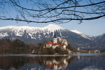 Beautiful mountains and Bled lake with small Pilgrimage Church. Bled lake and island with Church of...