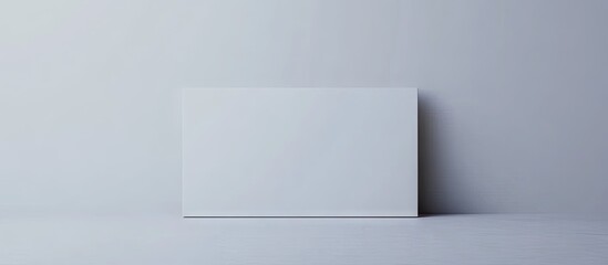 Minimalist interior showcasing a white canvas mockup on a light gray wall and floor creating a serene and modern atmosphere without any distractions