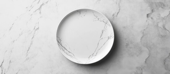 Elegant round plate mockup on a white marbled stone background showcasing minimalistic design with soft shadows and reflections. Perfect for presentations.