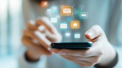 Mobile Notifications: A close-up shot of hands holding a smartphone, with vibrant email and notification icons floating above.