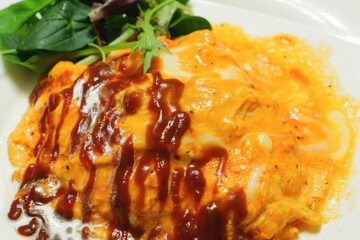 Delicious-looking omelette rice, freshly prepared with ketchup