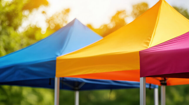 Colorful canopies in a sunny outdoor setting, creating a vibrant atmosphere perfect for events or gatherings.