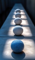 Spheres aligned in sunlight create a mesmerizing path of light and shadow
