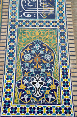 Uzbek ceramic porcelain mosaic with flowers on wall of madrasa in Uzbekistan, Asia