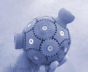 Person holding in hand three-dimensional model printed on 3D printer. An object created on 3D...
