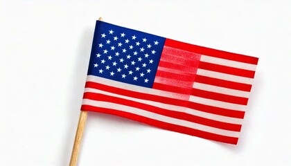 Fototapeta premium American flag waving on a flagpole, with blue sky background