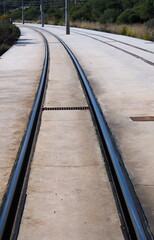 Railway track in a concrete foundation of local railway lines