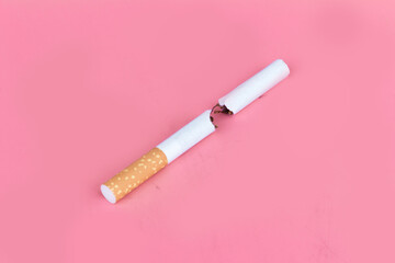 Cigarette butts isolated on pink background