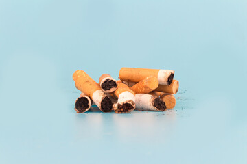 Cigarette butts isolated on blue background