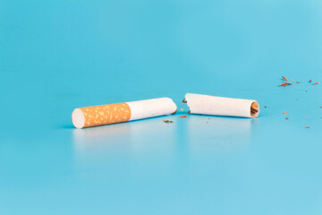 Cigarette butts isolated on blue background