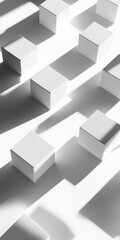An artistic composition featuring white cubes positioned on a surface, creating playful shadows. The minimalist design emphasizes simplicity and geometric beauty.