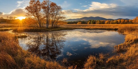 Fototapeta premium Captivating autumn scene with golden trees and a serene pond reflecting the sunset, set against a backdrop of mountains.
