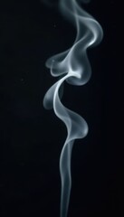 Wispy, gray smoke fragments drift against a pure black backdrop , fog, studio, subtle