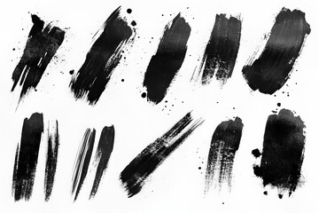 Black paint strokes and splashes on a white background showcasing artistic textures and contrasts