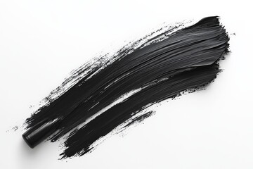 Black paint stroke on white canvas creates a striking contrast in artistic expression and design