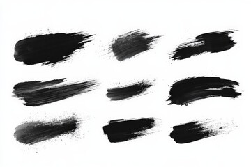 Various black paint brush strokes showcasing different textures and techniques on a white background